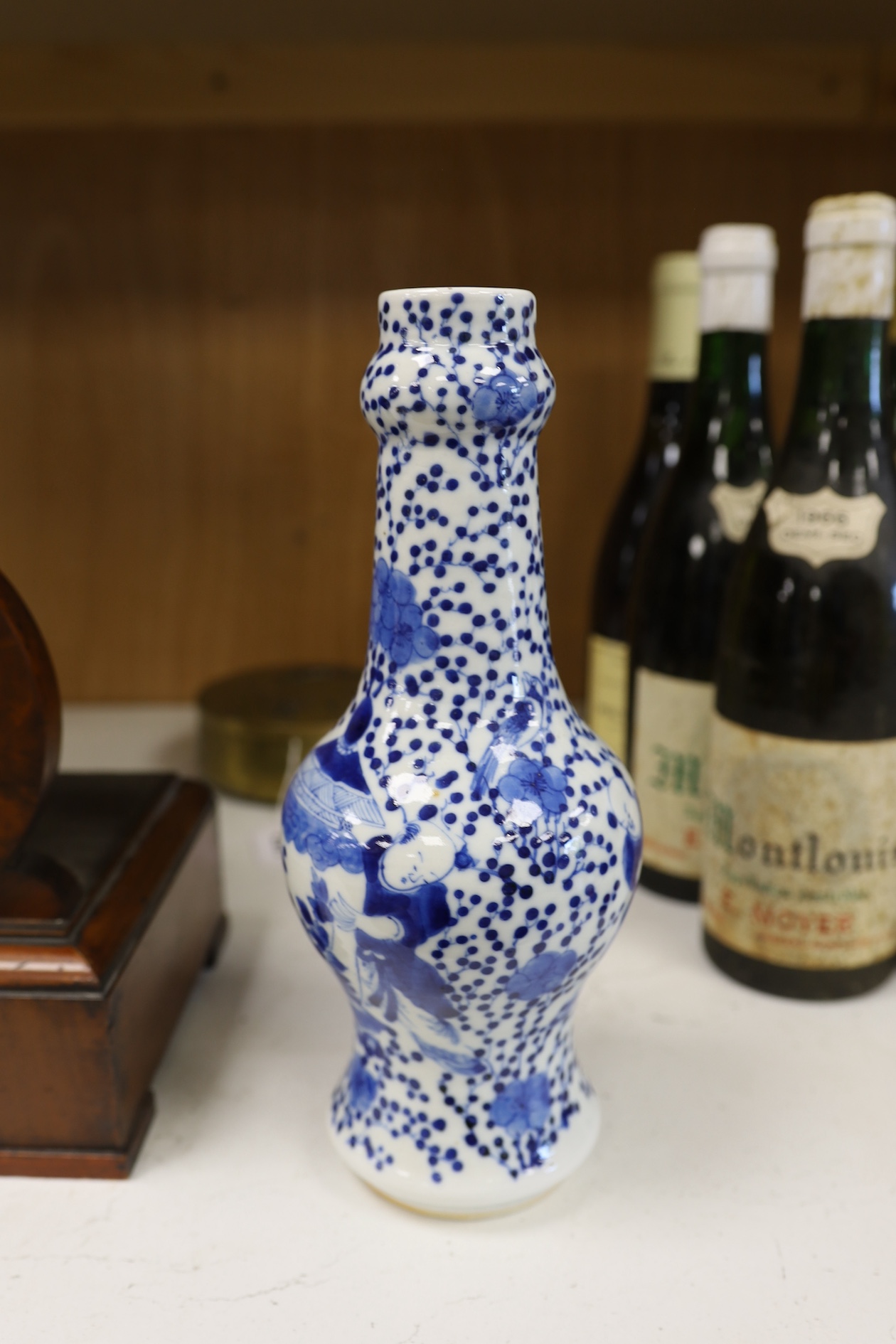 A Chinese blue and white 'boys' bottle vase, Kangxi mark but 19th century, 26cm high. Condition - good